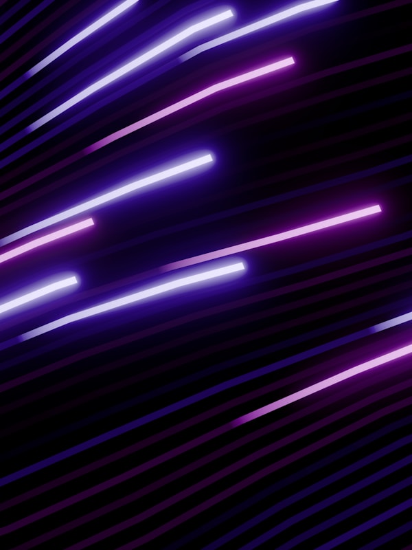 Abstract streaks of purple light on black.